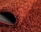 Unique Loom Solid Shag Collection Area Rug (7' 10" x 10' Oval, Terracotta)