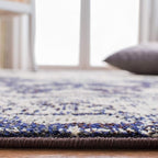 SAFAVIEH Monaco Collection Area Rug - 9' x 12', Ivory & Navy, Boho Chic Medallion Distressed Design, Non-Shedding & Easy Care, Ideal for High Traffic Areas in Living Room, Bedroom (MNC243C)
