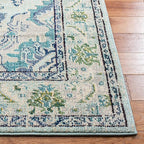 SAFAVIEH Monaco Collection Area Rug - 6'7" x 9'2", Light Blue & Ivory, Boho Chic Medallion Distressed Design, Non-Shedding & Easy Care, Ideal for High Traffic Areas in Living Room, Bedroom (MNC243K)