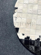 Round Geometric Patchwork Cowhide Leather Area Rug (4×4 ft) – Non-Slip Modern Faux Cowhide Carpet for Living Room, Bedroom, Kids Playroom, Lounge, Office & Home Decor (Black & White)